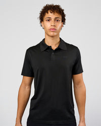 Man wearing Drive Seamless Polo - Black | Model:Leandro | Size:M | Thumbnail Index: 0