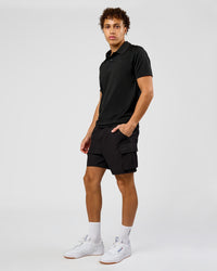 Man wearing Drive Seamless Polo - Black | Model:Leandro | Size:M | Thumbnail Index: 4