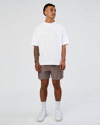Man wearing Energy Stretch 6" Performance Cargo Short - Iron | Model:Daarian | Size:M