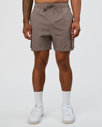 Man wearing Energy Stretch 6" Performance Cargo Short - Iron | Model:Daarian | Size:M