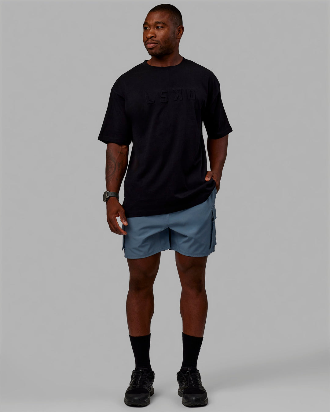 Man wearing Energy Stretch Performance Cargo Shorts - Storm