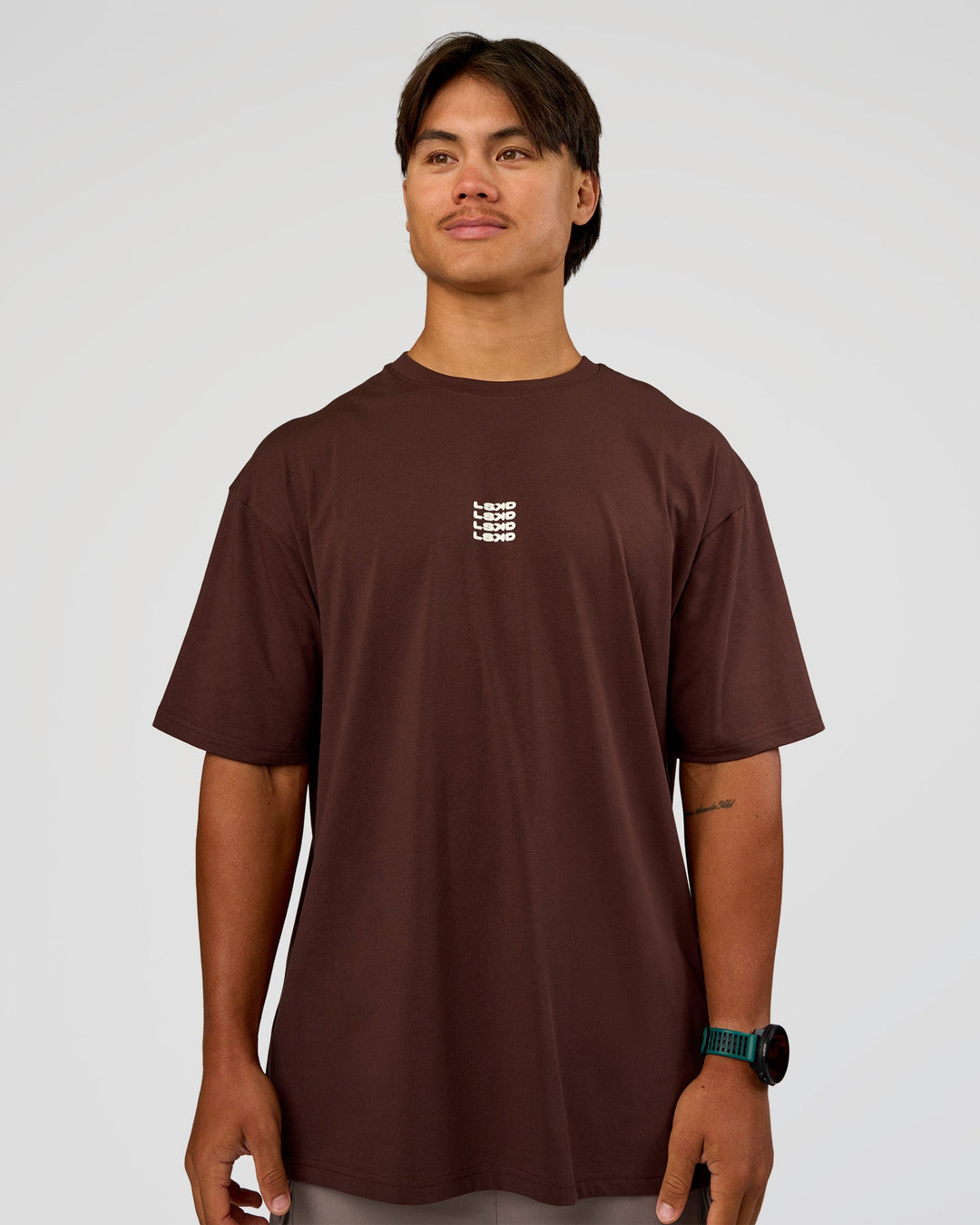 Man wearing Everyday Elevation FLXCotton Oversized Tee - Hot Chocolate-Off White | Model:George | Size:M