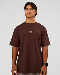 Man wearing Everyday Elevation FLXCotton Oversized Tee - Hot Chocolate-Off White | Model:George | Size:M