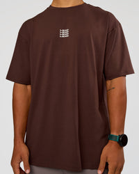 Man wearing Everyday Elevation FLXCotton Oversized Tee - Hot Chocolate-Off White | Model:George | Size:M