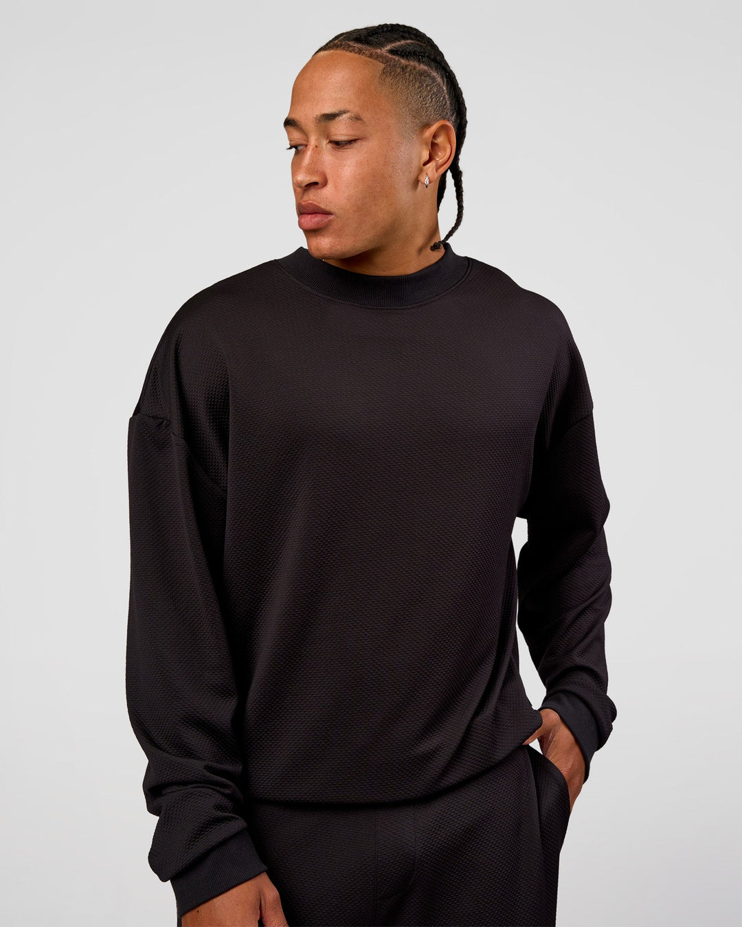 Man wearing Everyday Elevation Waffle Oversized Sweater - Black | Model:Malebo | Size:M