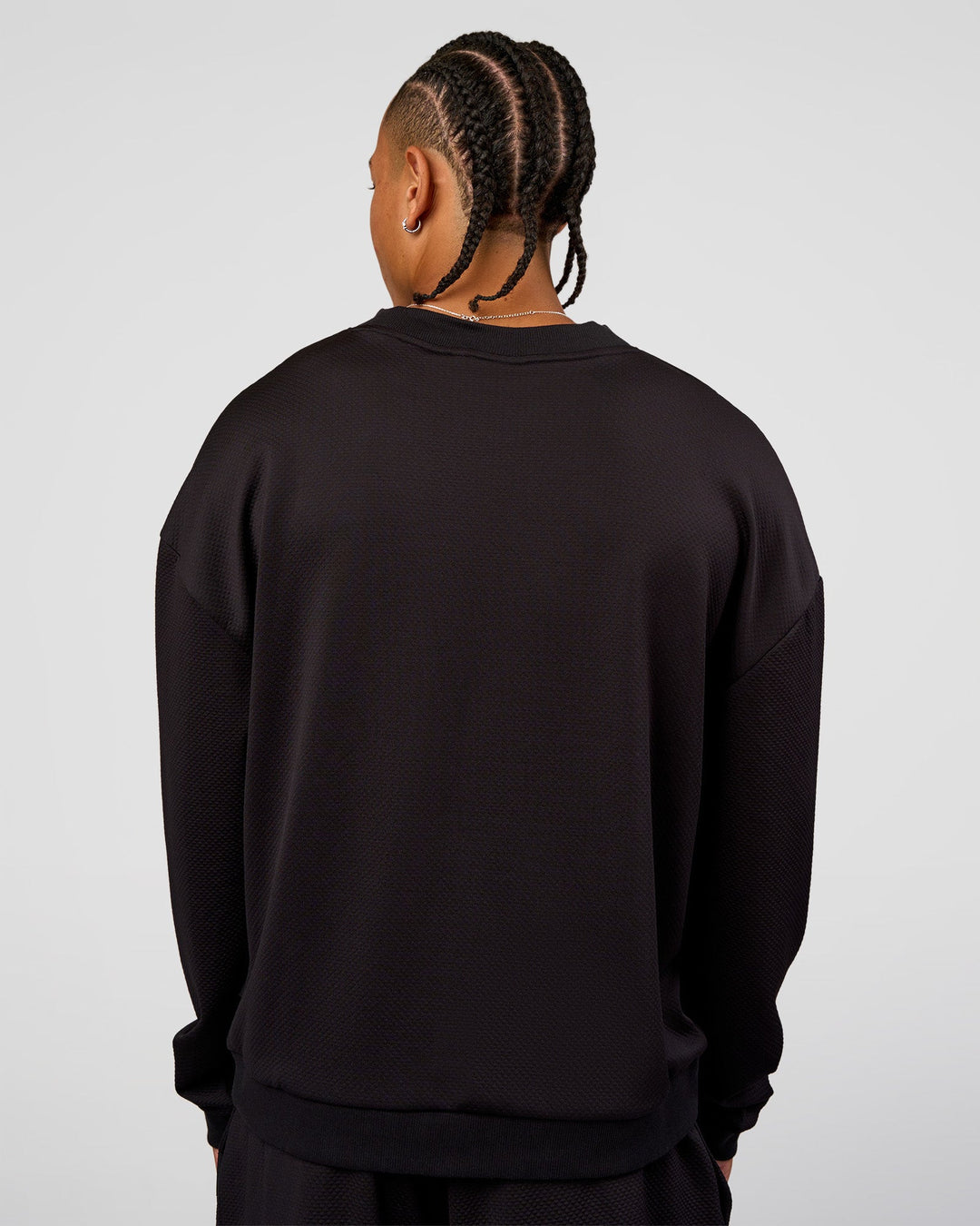 Man wearing Everyday Elevation Waffle Oversized Sweater - Black | Model:Malebo | Size:M