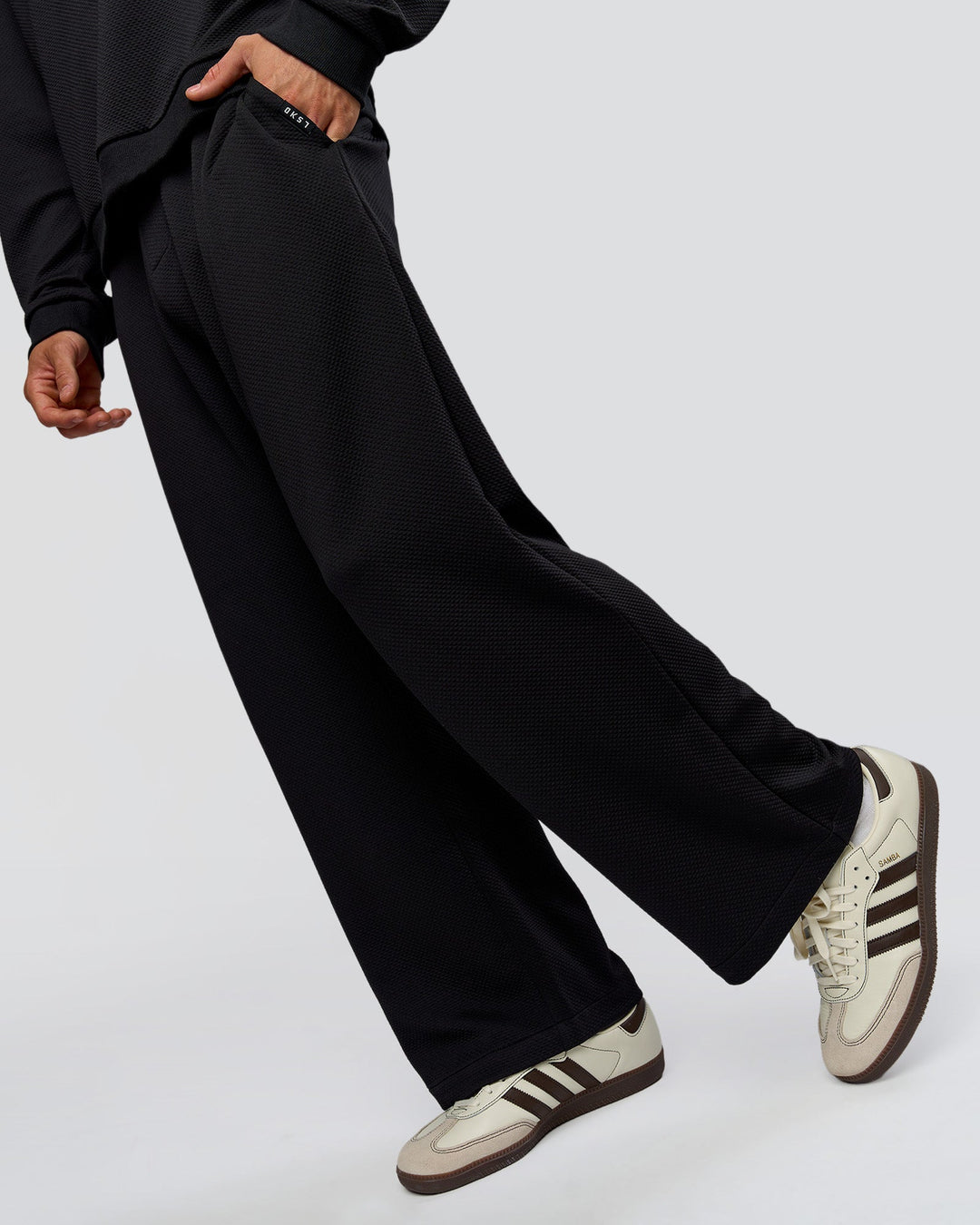 Man wearing Everyday Elevation Waffle Wide Leg Pant - Black | Model:Albert | Size:M