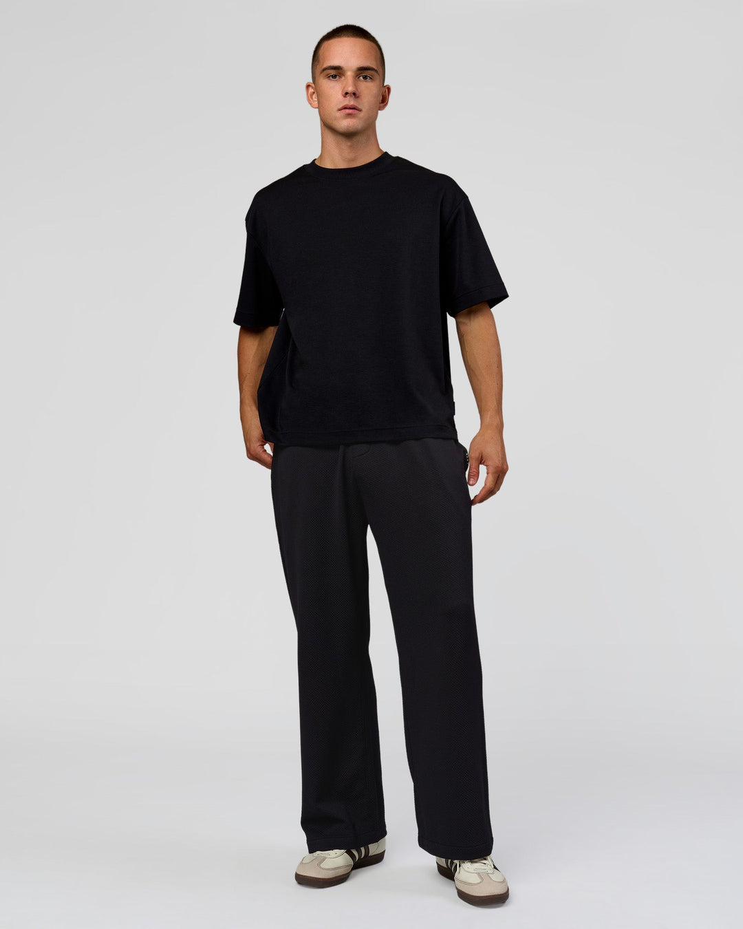 Man wearing Everyday Elevation Waffle Wide Leg Pant - Black | Model:Albert | Size:M