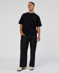 Man wearing Everyday Elevation Waffle Wide Leg Pant - Black | Model:Albert | Size:M