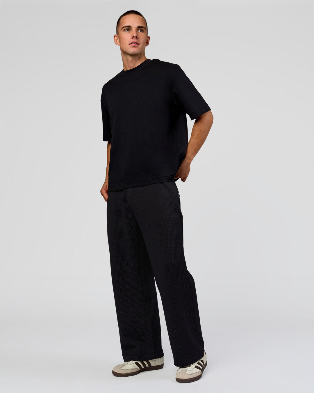 Man wearing Everyday Elevation Waffle Wide Leg Pant - Black | Model:Albert | Size:M