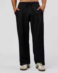 Man wearing Everyday Elevation Waffle Wide Leg Pant - Black | Model:Albert | Size:M