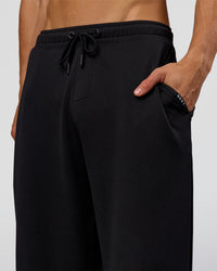 Man wearing Everyday Elevation Waffle Wide Leg Pant - Black | Model:Albert | Size:M