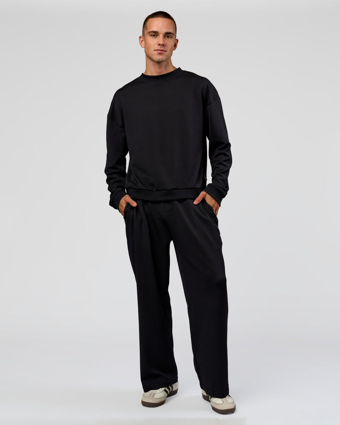 Man wearing Everyday Elevation Waffle Wide Leg Pant - Black | Model:Albert | Size:M