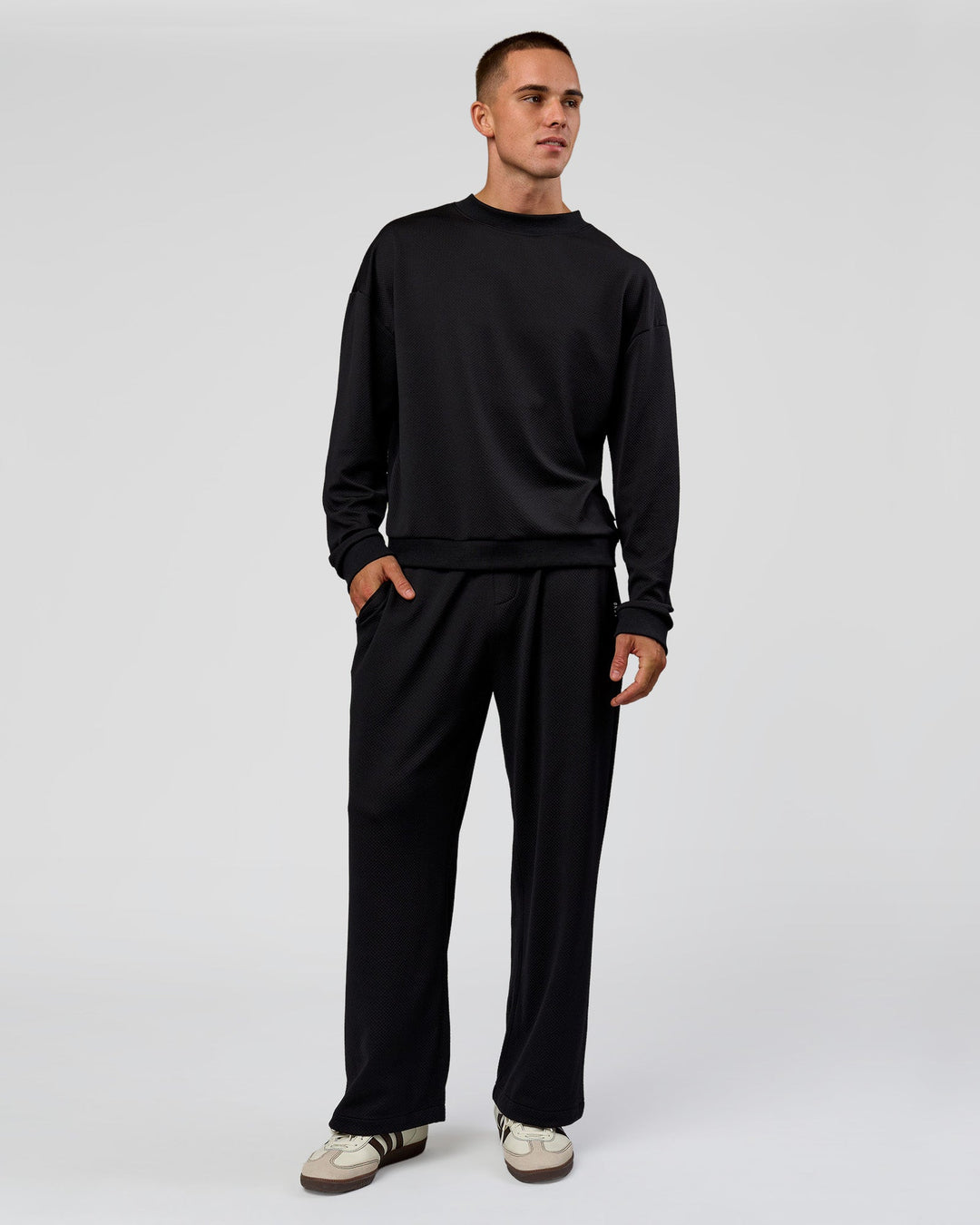 Man wearing Everyday Elevation Waffle Wide Leg Pant - Black | Model:Albert | Size:M