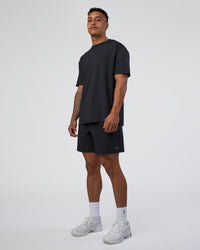 Man wearing Forever EffortlessTech Tee - Black | Model:Daarian | Size:M