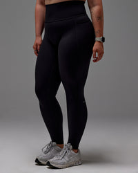 Woman wearing Fusion Ultra High-Rise Full Length Legging Pockets - Black | Model:Caity | Size:M