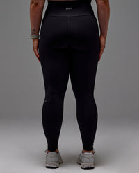 Woman wearing Fusion Ultra High-Rise Full Length Legging Pockets - Black | Model:Caity | Size:M
