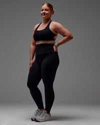 Woman wearing Fusion Ultra High-Rise Full Length Legging Pockets - Black | Model:Caity | Size:M
