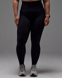 Woman wearing Fusion Ultra High-Rise Full Length Legging Pockets - Black | Model:Caity | Size:M