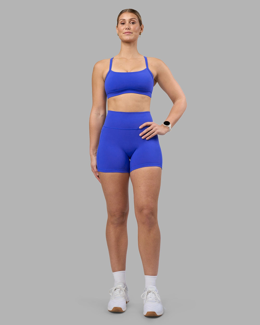 Woman wearing Fusion Ultra High-Rise 4&quot; Short Pockets - Power Cobalt | Model:Amy | Size:M