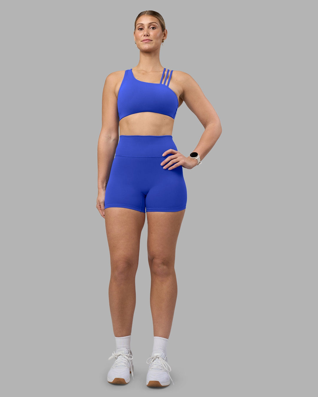 Woman wearing Fusion Ultra High-Rise 4&quot; Short - Power Cobalt | Model:Amy | Size:M