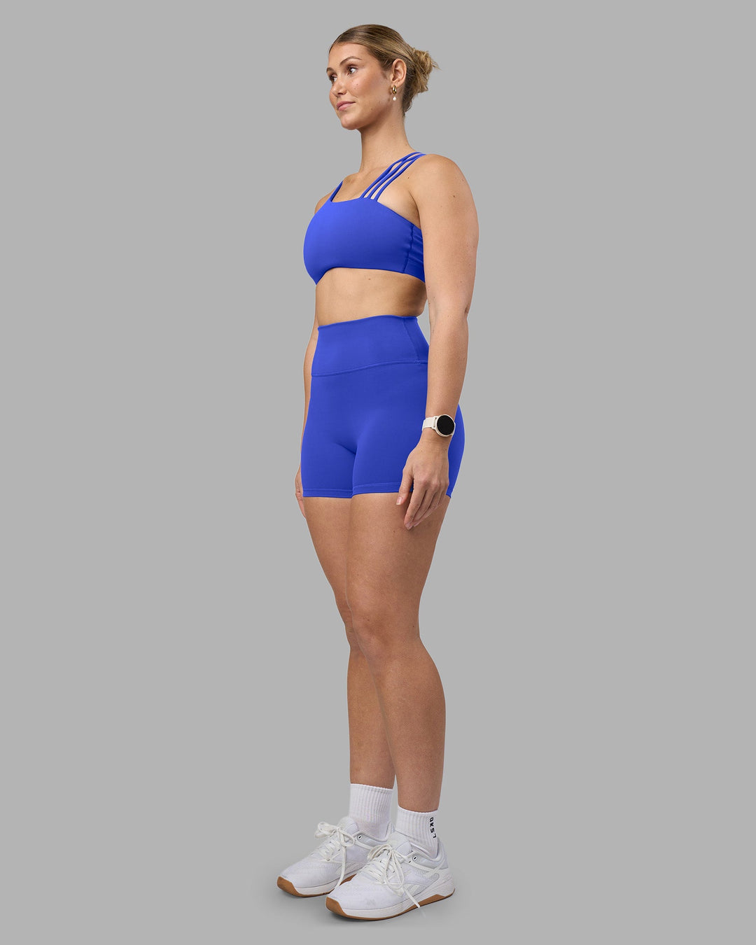Woman wearing Fusion Ultra High-Rise 4&quot; Short - Power Cobalt | Model:Amy | Size:M
