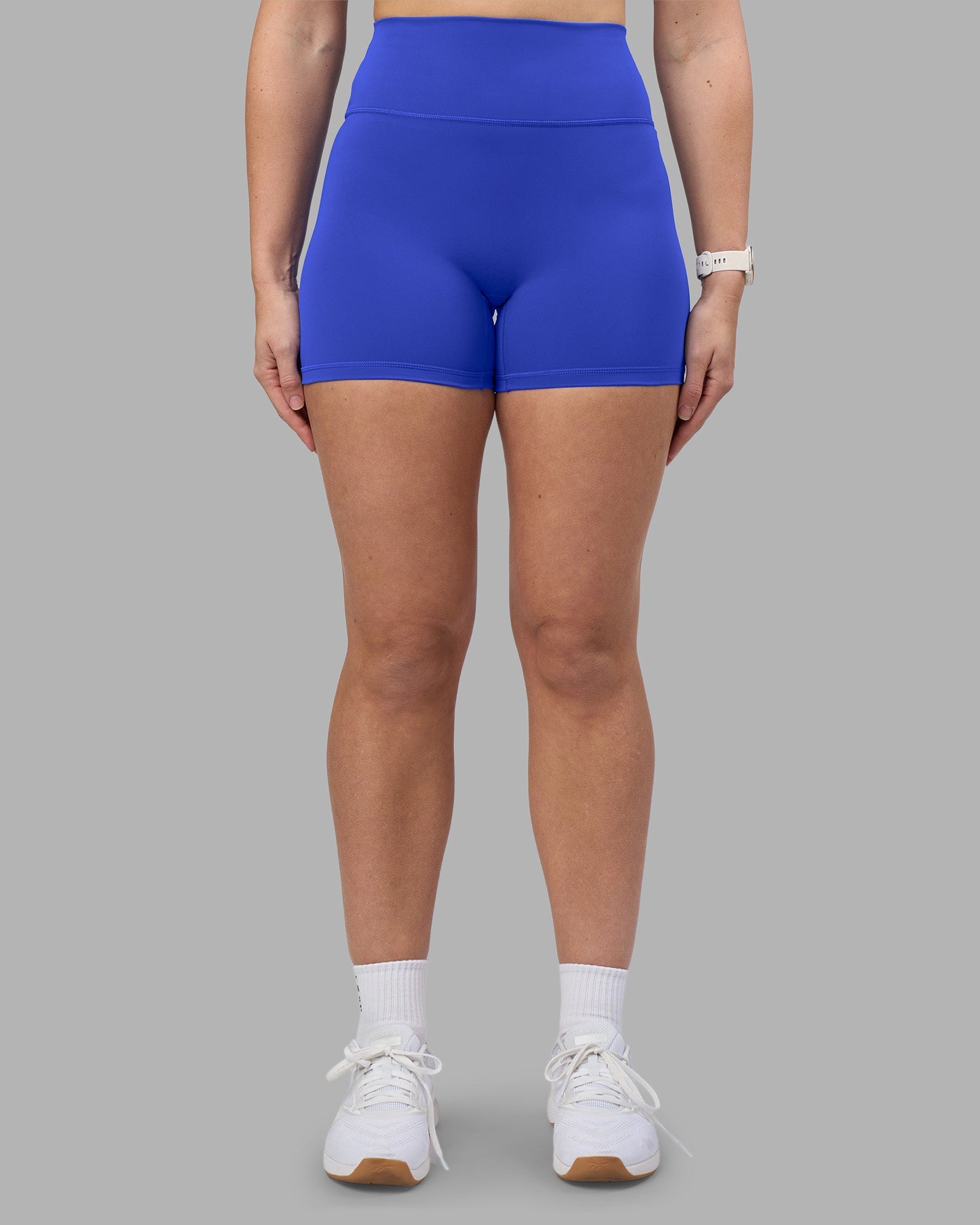 Woman wearing Fusion Ultra High-Rise 4" Short - Power Cobalt | Model:Amy | Size:M