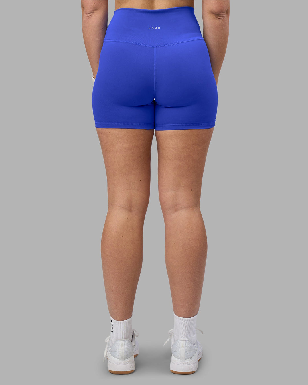 Woman wearing Fusion Ultra High-Rise 4&quot; Short - Power Cobalt | Model:Amy | Size:M