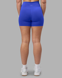 Woman wearing Fusion Ultra High-Rise 4" Short - Power Cobalt | Set:true | Angle:back | Model:Amy | Size:M
