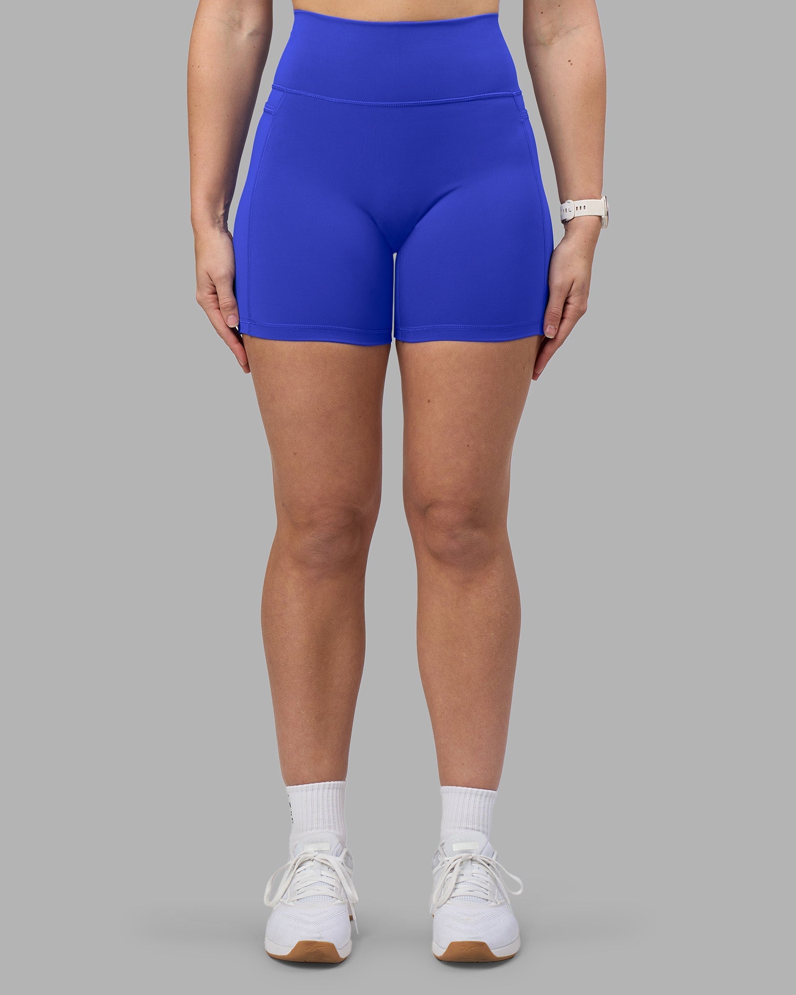 Woman wearing Fusion Ultra High-Rise 6" Short Pockets - Power Cobalt | Model:Amy | Size:M