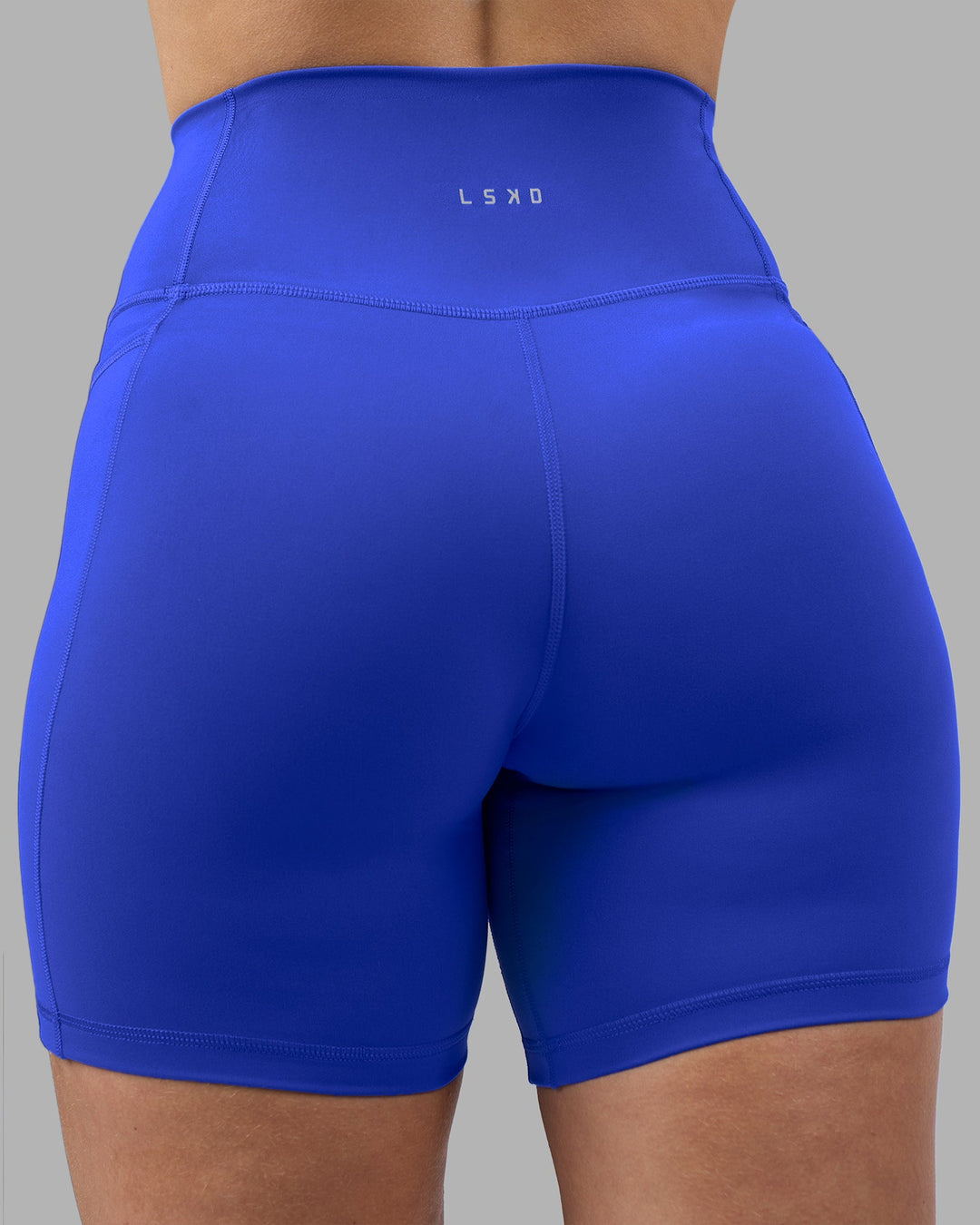 Woman wearing Fusion Ultra High-Rise 6&quot; Short Pockets - Power Cobalt | Model:Amy | Size:M