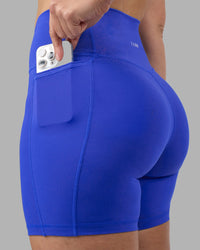 Woman wearing Fusion Ultra High-Rise 6" Short Pockets - Power Cobalt | Model:Amy | Size:M