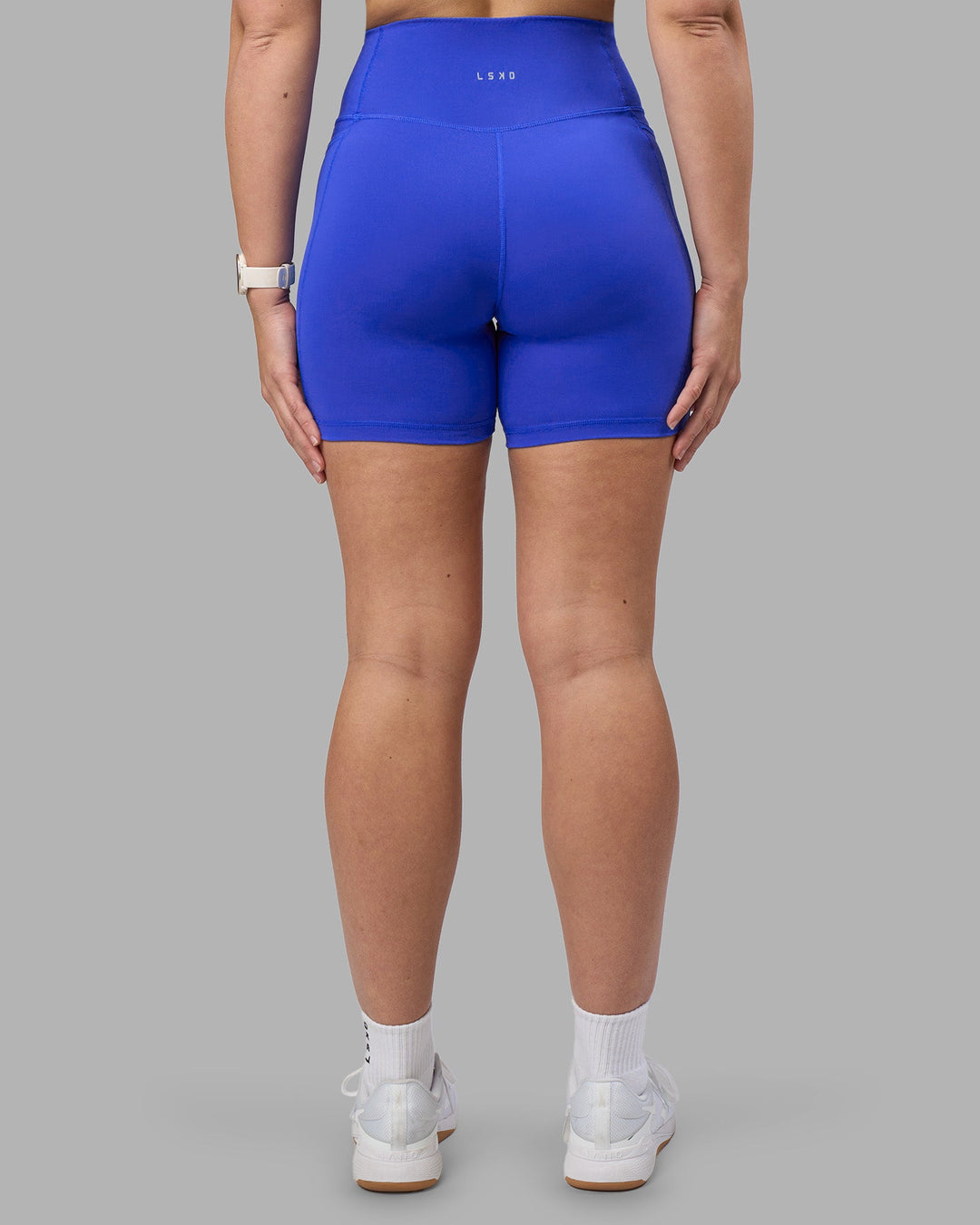 Woman wearing Fusion Ultra High-Rise 6&quot; Short Pockets - Power Cobalt | Model:Amy | Size:M