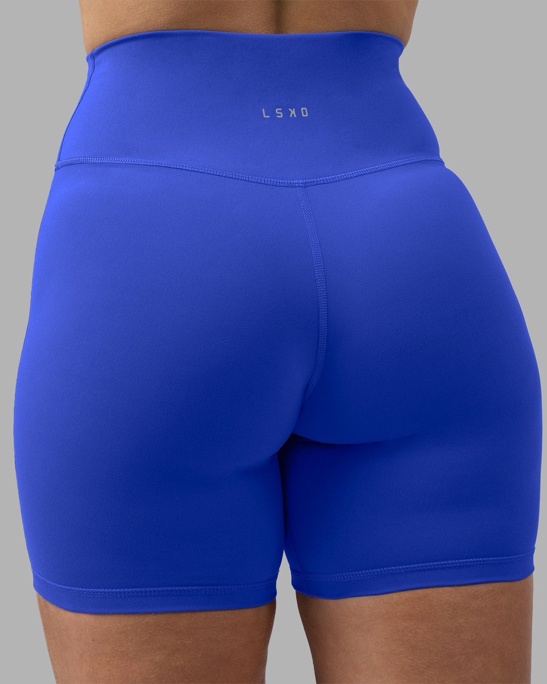 Woman wearing Fusion Ultra High-Rise 6&quot; Short - Power Cobalt | Model:Amy | Size:M
