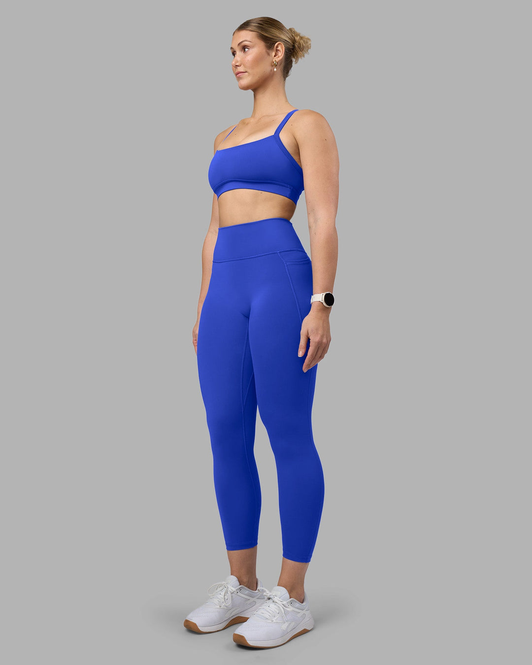 Woman wearing Fusion Ultra High-Rise 7/8 Legging Pockets - Power Cobalt | Model:Amy | Size:M