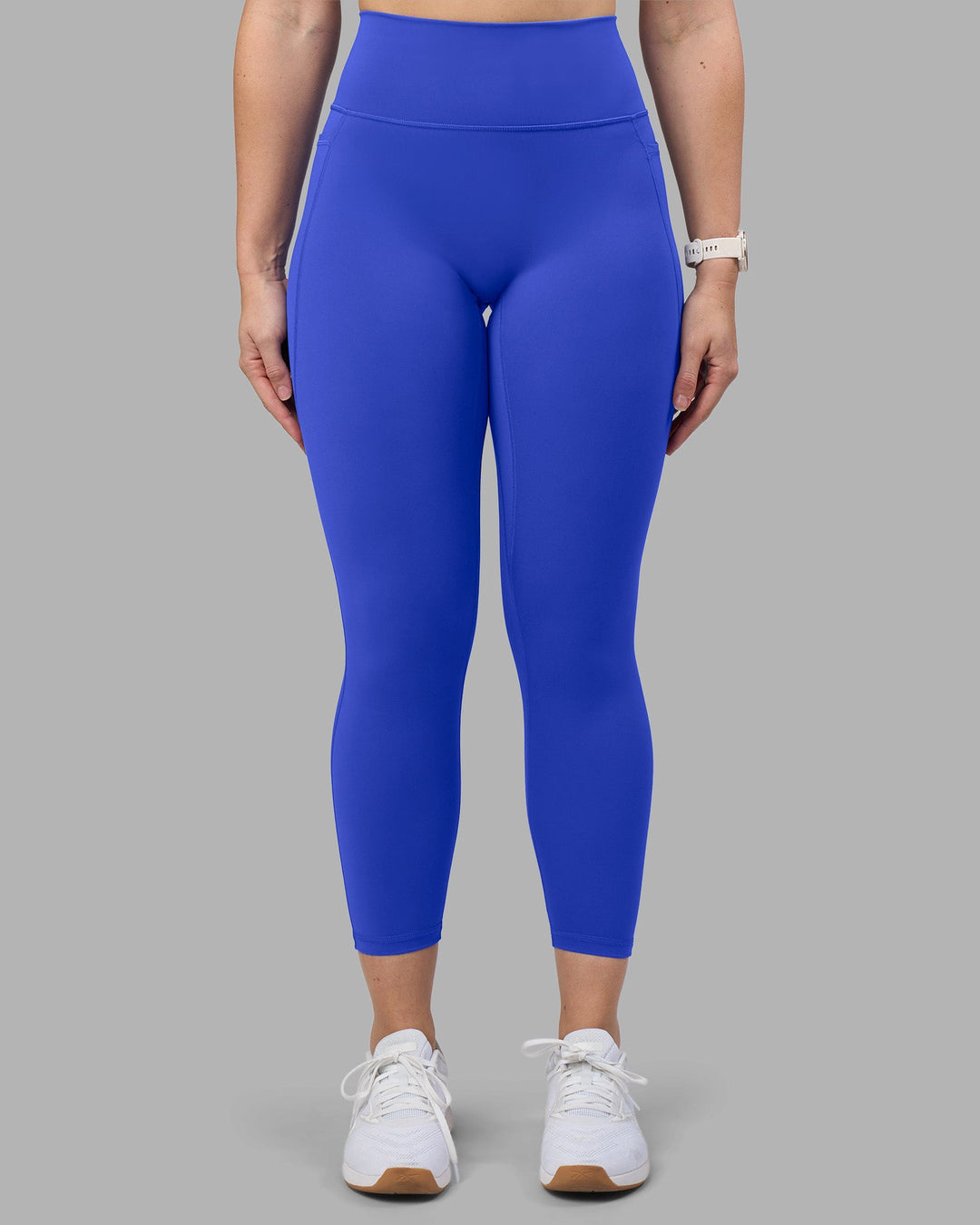 Woman wearing Fusion Ultra High-Rise 7/8 Legging Pockets - Power Cobalt | Model:Amy | Size:M