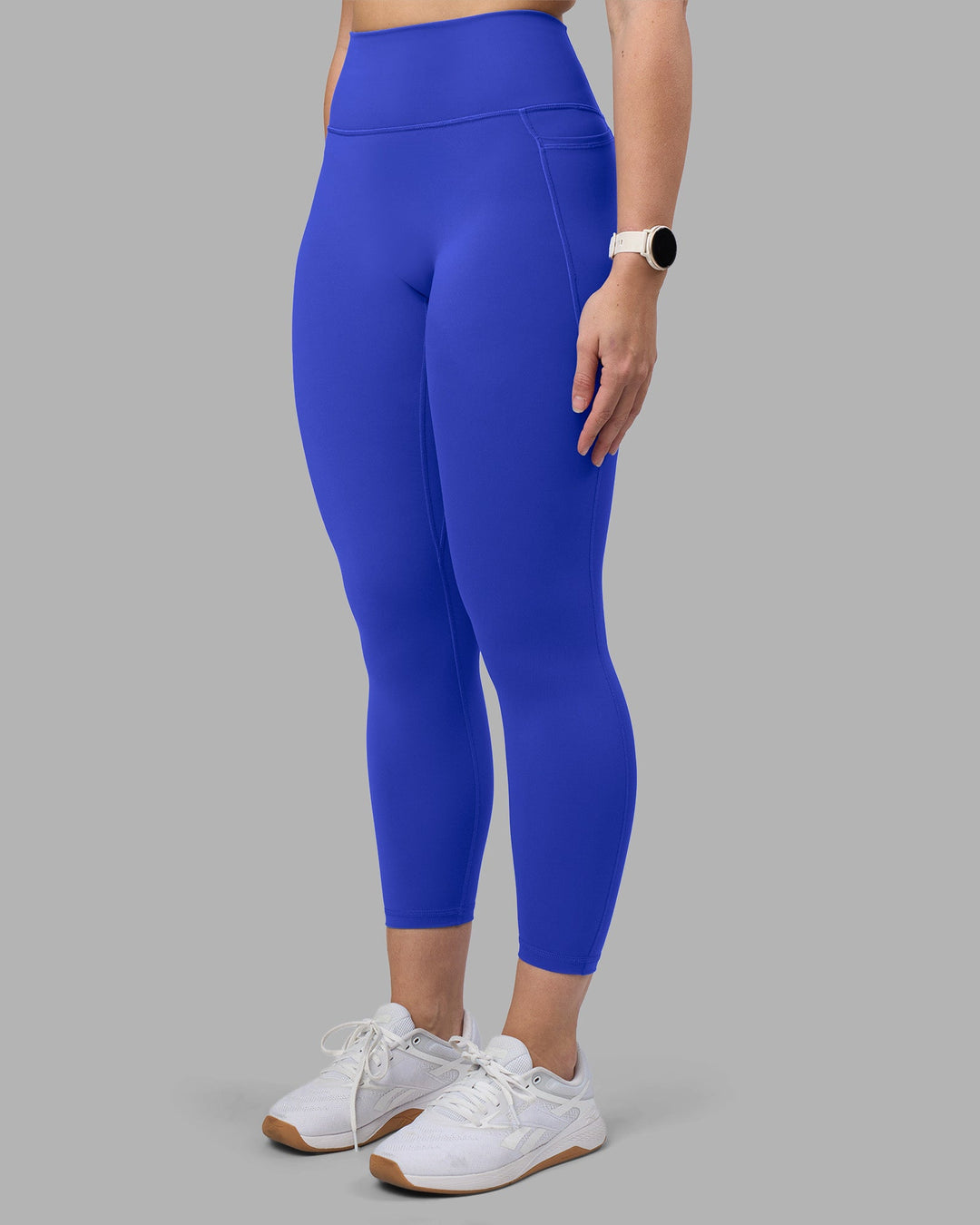 Woman wearing Fusion Ultra High-Rise 7/8 Legging Pockets - Power Cobalt | Model:Amy | Size:M