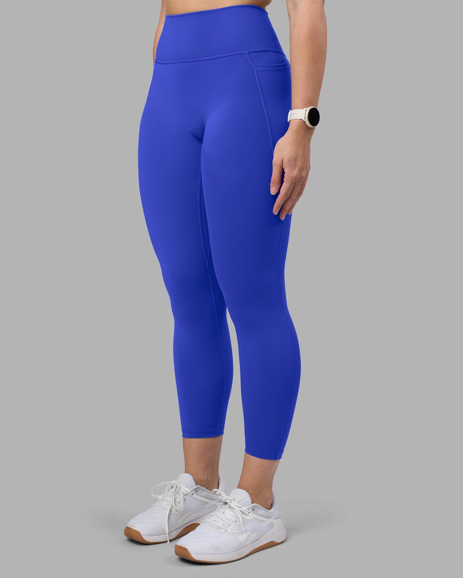 Woman wearing Fusion Ultra High-Rise 7/8 Legging Pockets - Power Cobalt | Model:Amy | Size:M