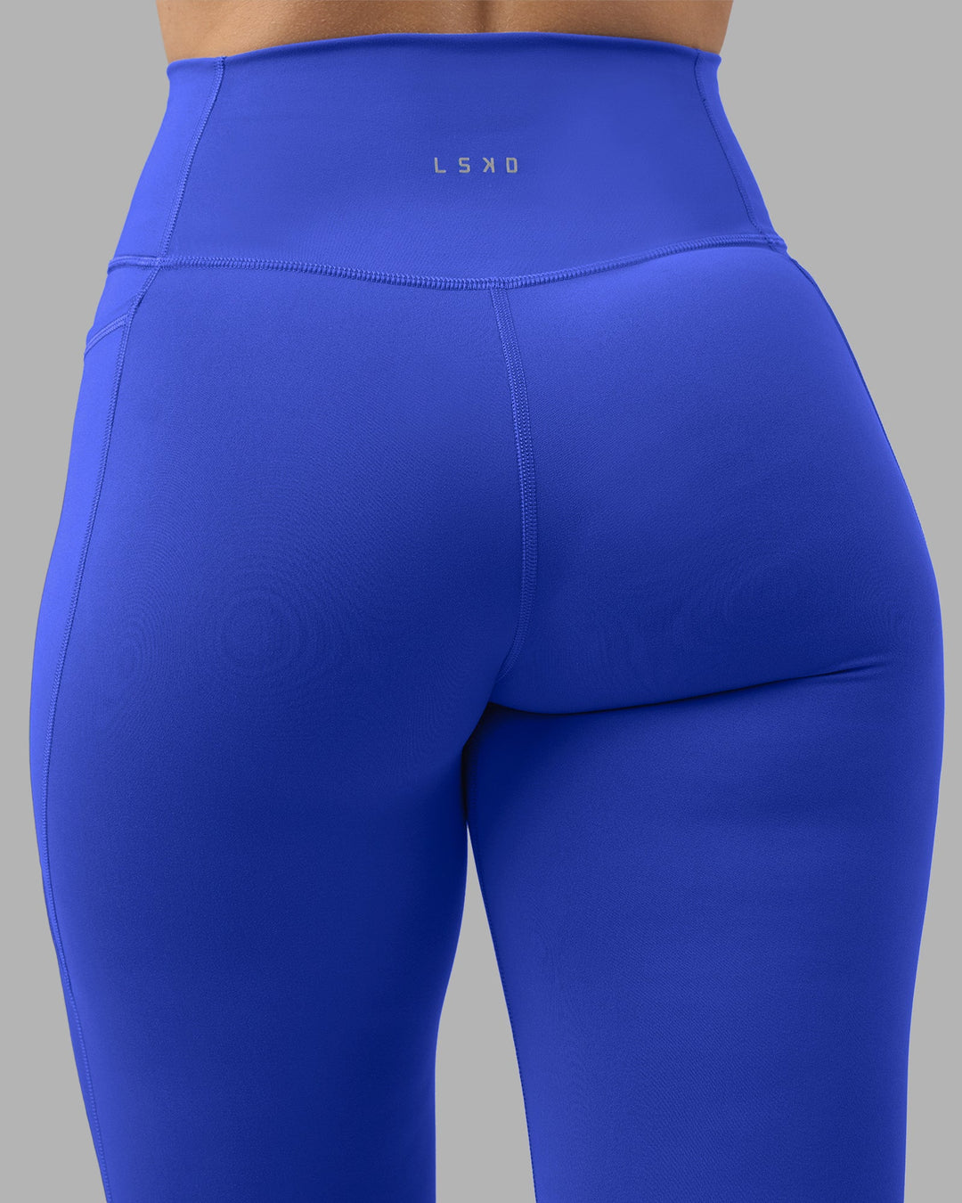 Woman wearing Fusion Ultra High-Rise 7/8 Legging Pockets - Power Cobalt | Model:Amy | Size:M