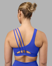 Woman wearing Galvanise Sports Bra 2.0 - Power Cobalt | Model:Amy | Size:M