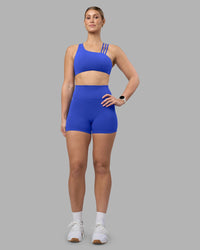 Woman wearing Galvanise Sports Bra 2.0 - Power Cobalt | Model:Amy | Size:M