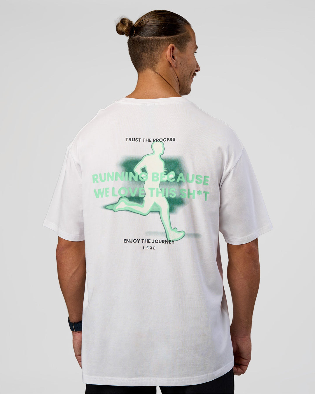 Man wearing High Run FLXCotton Oversized Tee - White-Jelly Mint | Model:Jaiden | Size:M