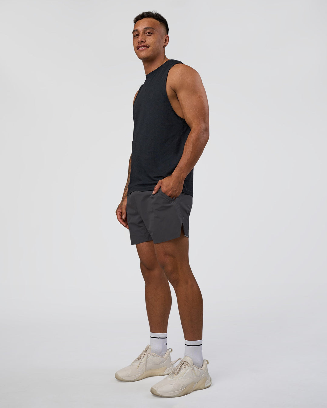 Man wearing Hybrid 5" Short - Dark Storm | Model:Daarian | Size:M - view 2