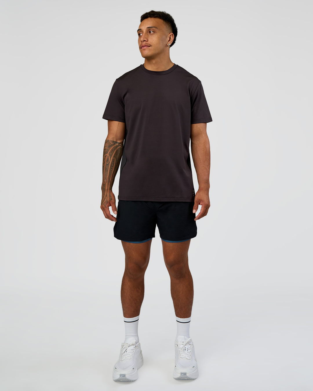 Man wearing Hybrid Lined 5" Short - Black-Indigo | Model:Daarian | Size:M