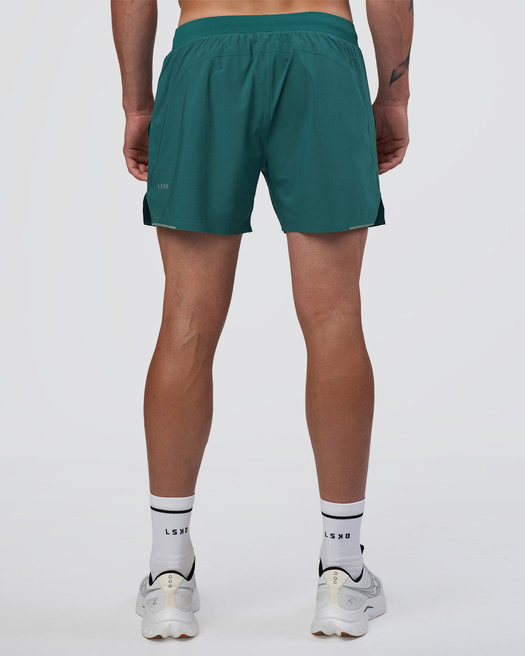 Man wearing Hybrid Lined 5" Short - Transformative Teal | Model:Konnor | Size:M