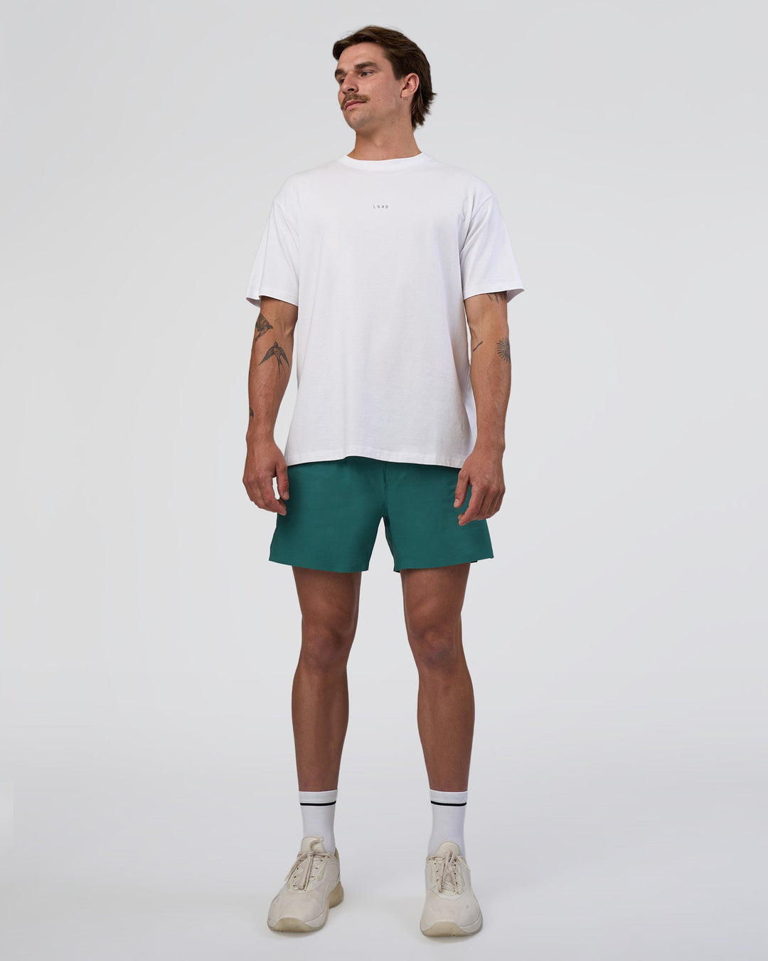 Man wearing Hybrid Lined 5" Short - Transformative Teal | Model:Konnor | Size:M