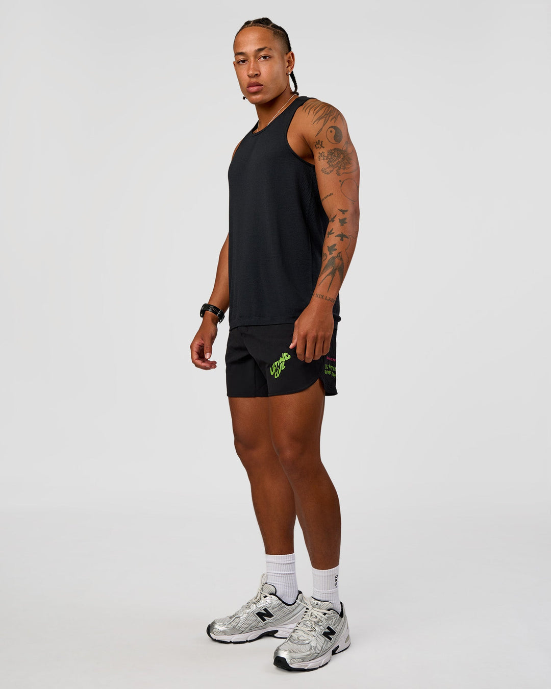 Man wearing Lift 6" Short - Black-Sugar Plum Lime | Model:Malebo | Size:M