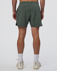 Man wearing Lift 6" Short - Carbon Green | Model:Konnor | Size:M
