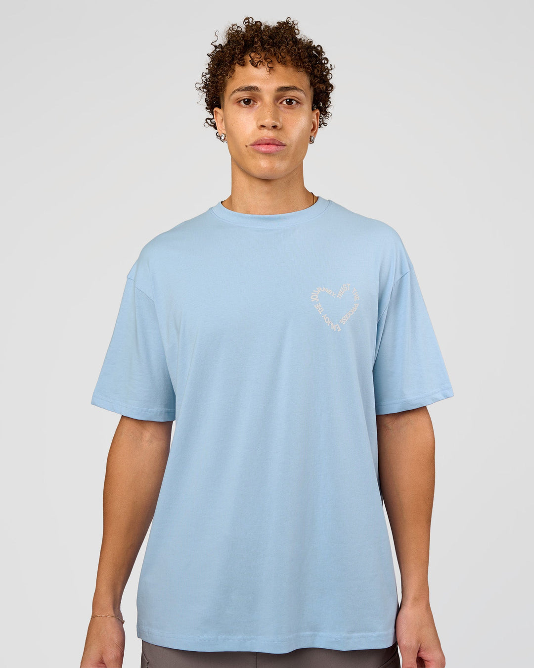 Man wearing Love The Process FLXCotton Oversize Tee - Open Air-Off White | Model:Leandro | Size:M - view 3