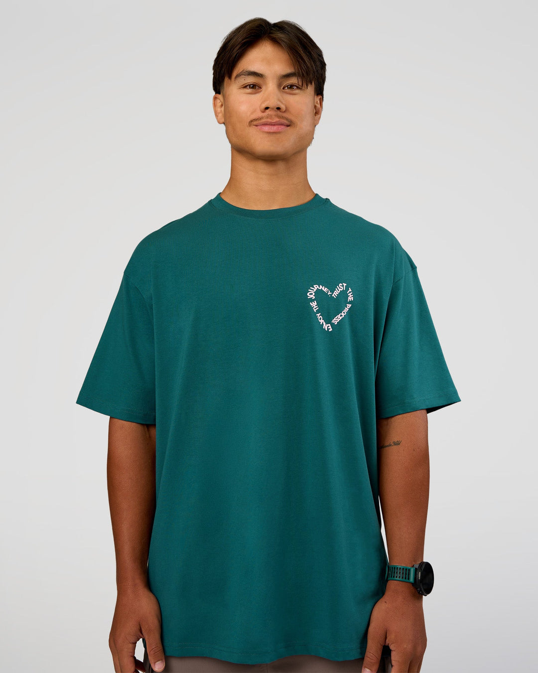 Man wearing Love The Process FLXCotton Oversize Tee - Transformative Teal-Marshmallow | Model:George | Size:M